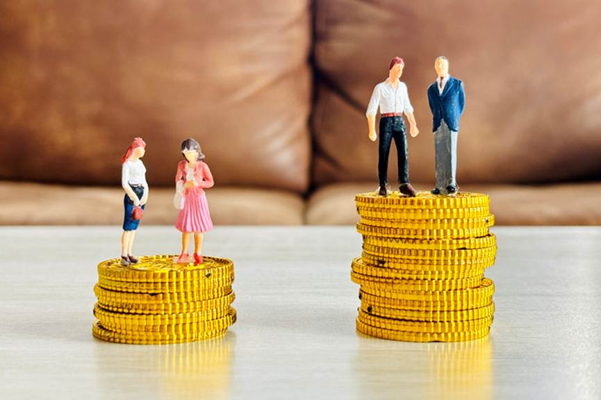 Toy people standing on large and small stacks of coins - Employment Law